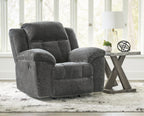 Graphite fabric rocker recliner chair with panelled back and padded armrests