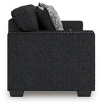 Black textured accent chair with squared arms and removable-look seat cushions