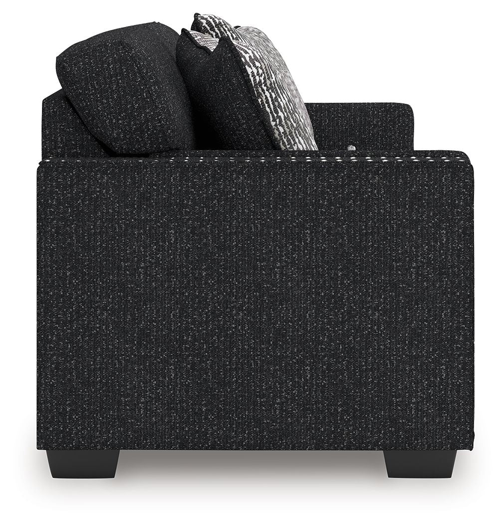 Black textured accent chair with squared arms and removable-look seat cushions