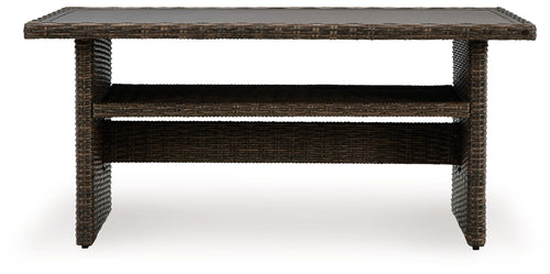 Brown rectangular multi-use table with woven sides and open shelf