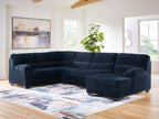 Navy sectional sofa with corner chaise and tufted back cushions
