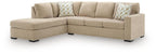 Light brown sleeper sectional sofa with corner chaise and patterned throw pillows
