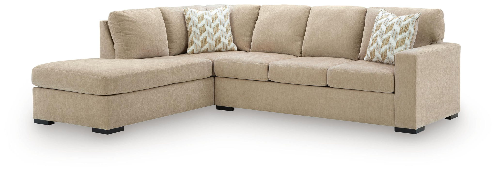 Light brown sleeper sectional sofa with corner chaise and patterned throw pillows