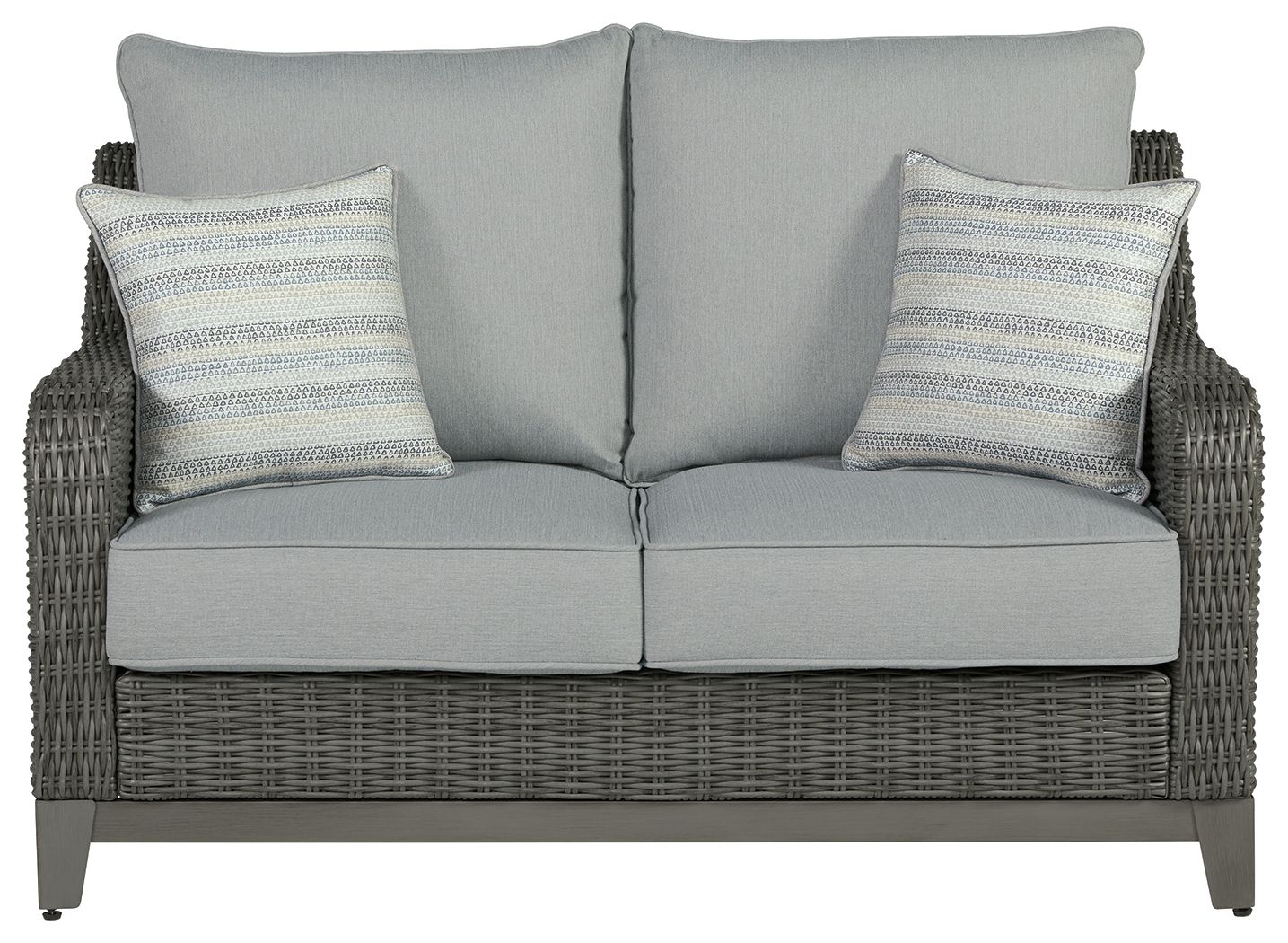 Gray wicker loveseat with two back cushions and two striped throw pillows