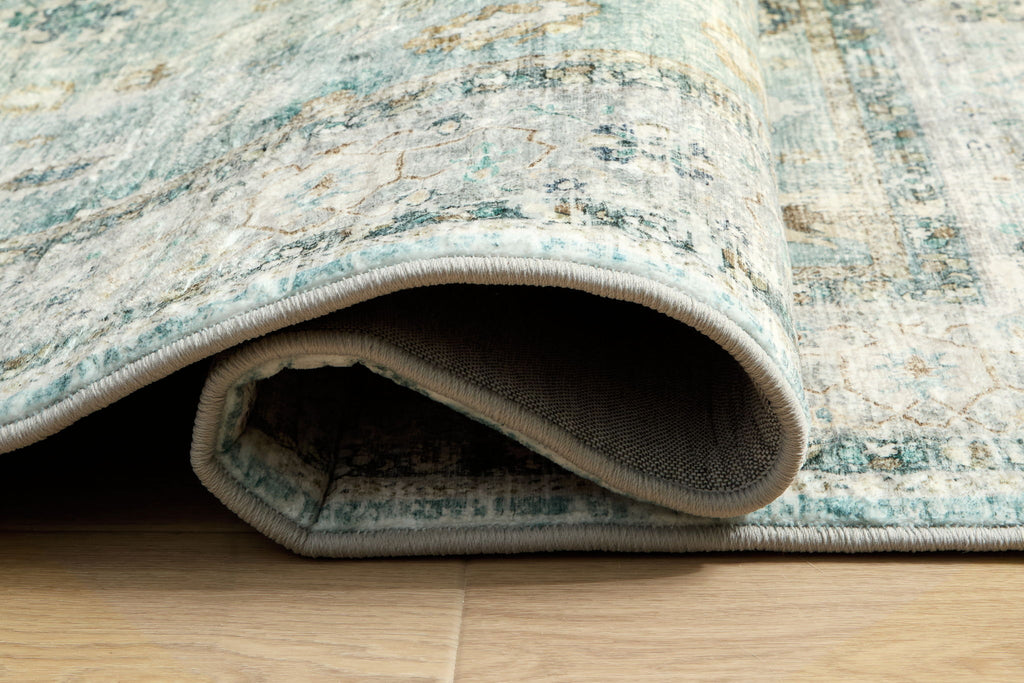 Ladstoney rug rolled edge showing textured backing and short pile