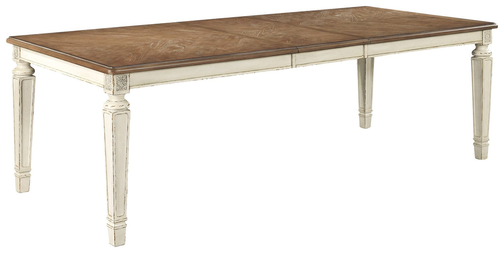 Rectangular dining table with brown wood top and white carved legs