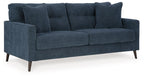 Blue upholstered sofa with three back cushions and wide track arms