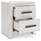 Whitewash two-drawer night stand with one drawer open and dark pulls