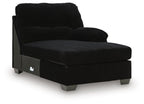 Onyx black corner chaise with front panel pocket detail and low metal legs