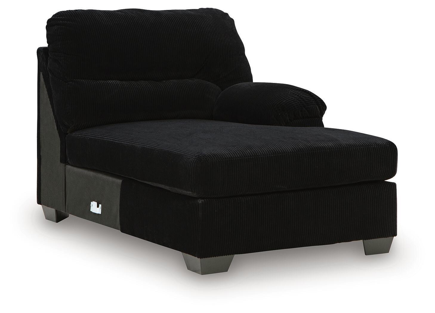 Onyx black corner chaise with front panel pocket detail and low metal legs