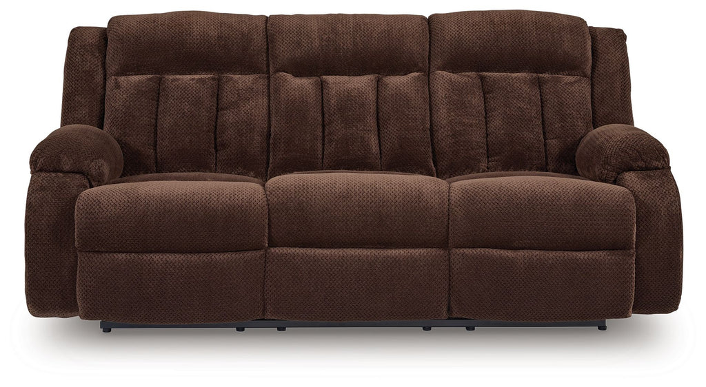 Chocolate brown reclining power sofa with three-seat cushions and padded armrests