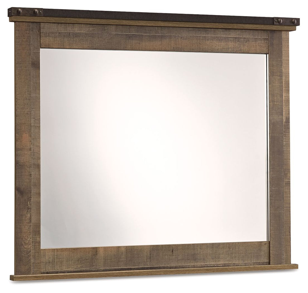 Brown bedroom mirror with rectangular wood frame and dark top trim