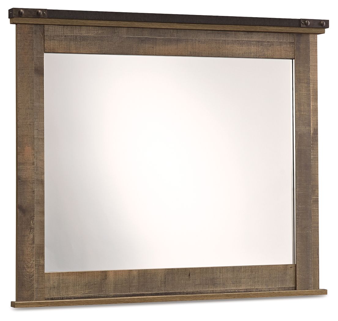 Brown bedroom mirror with rectangular wood frame and dark top trim