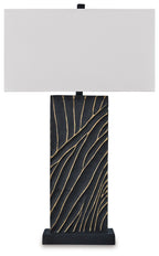 Black table lamp with white fabric shade and gold linear pattern base