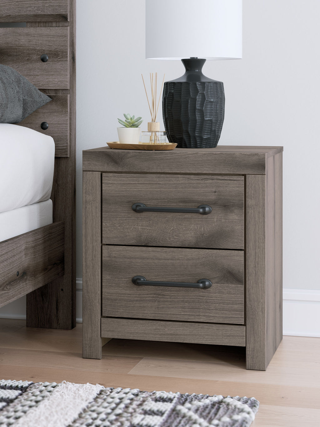 Gray two-drawer night stand with metal bar handles