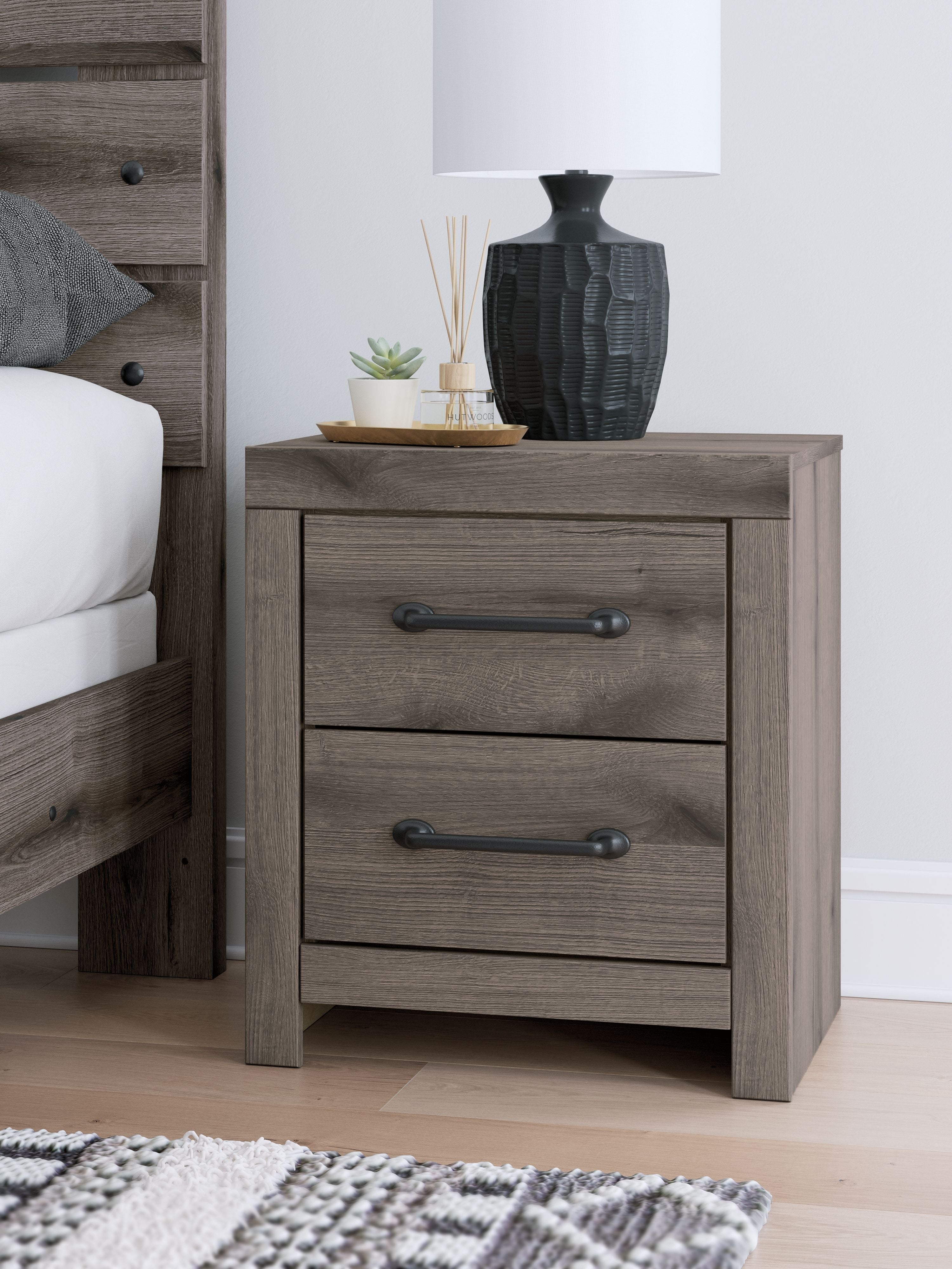 Gray two-drawer night stand with metal bar handles