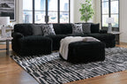 Black sectional sofa set with chaise lounge and coordinating ottoman pieces