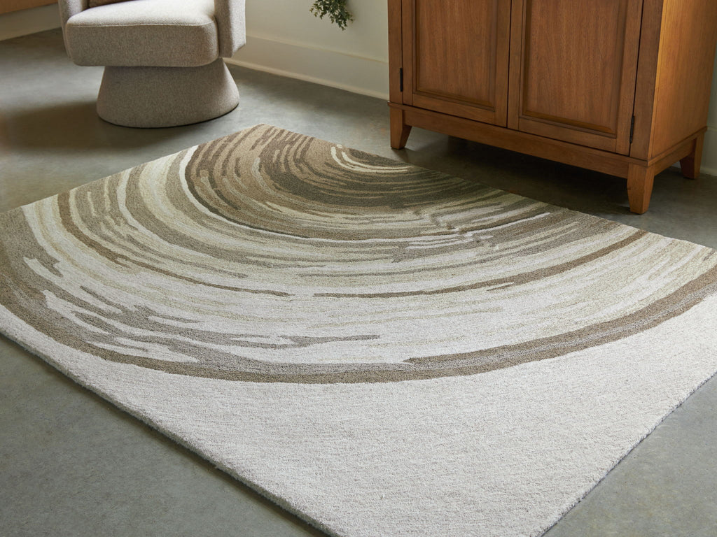 Rug in cream and dark olive with concentric wave stripes, textured low pile