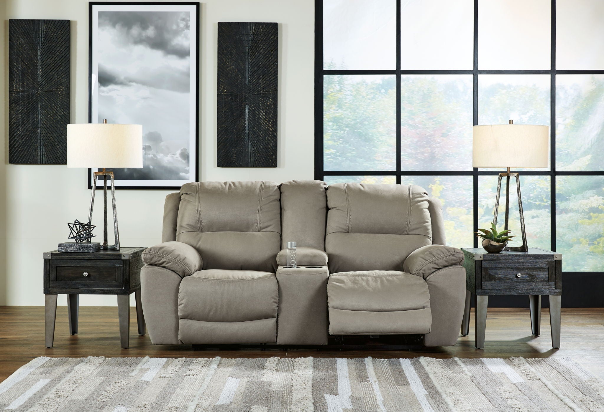 Loveseat recliner in light putty gray fabric with padded console and recline sections