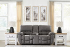Dark gray power recline loveseat with adjustable headrests, plush armrests