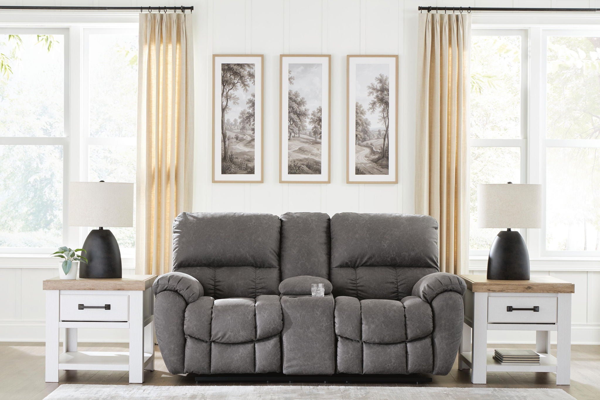 Dark gray power recline loveseat with adjustable headrests, plush armrests