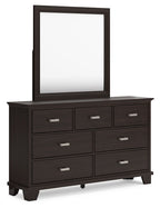 Dark brown dresser with rectangular mirror and multiple drawers, silver bar pulls.