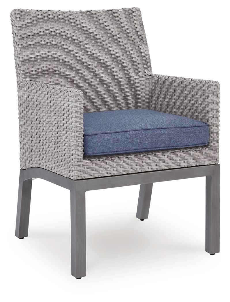 Gray woven single armchair with blue seat cushion, wide arms, sturdy legs