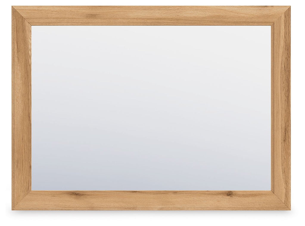 Rectangular bedroom mirror with warm brown wooden frame