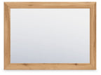 Rectangular bedroom mirror with warm brown wooden frame