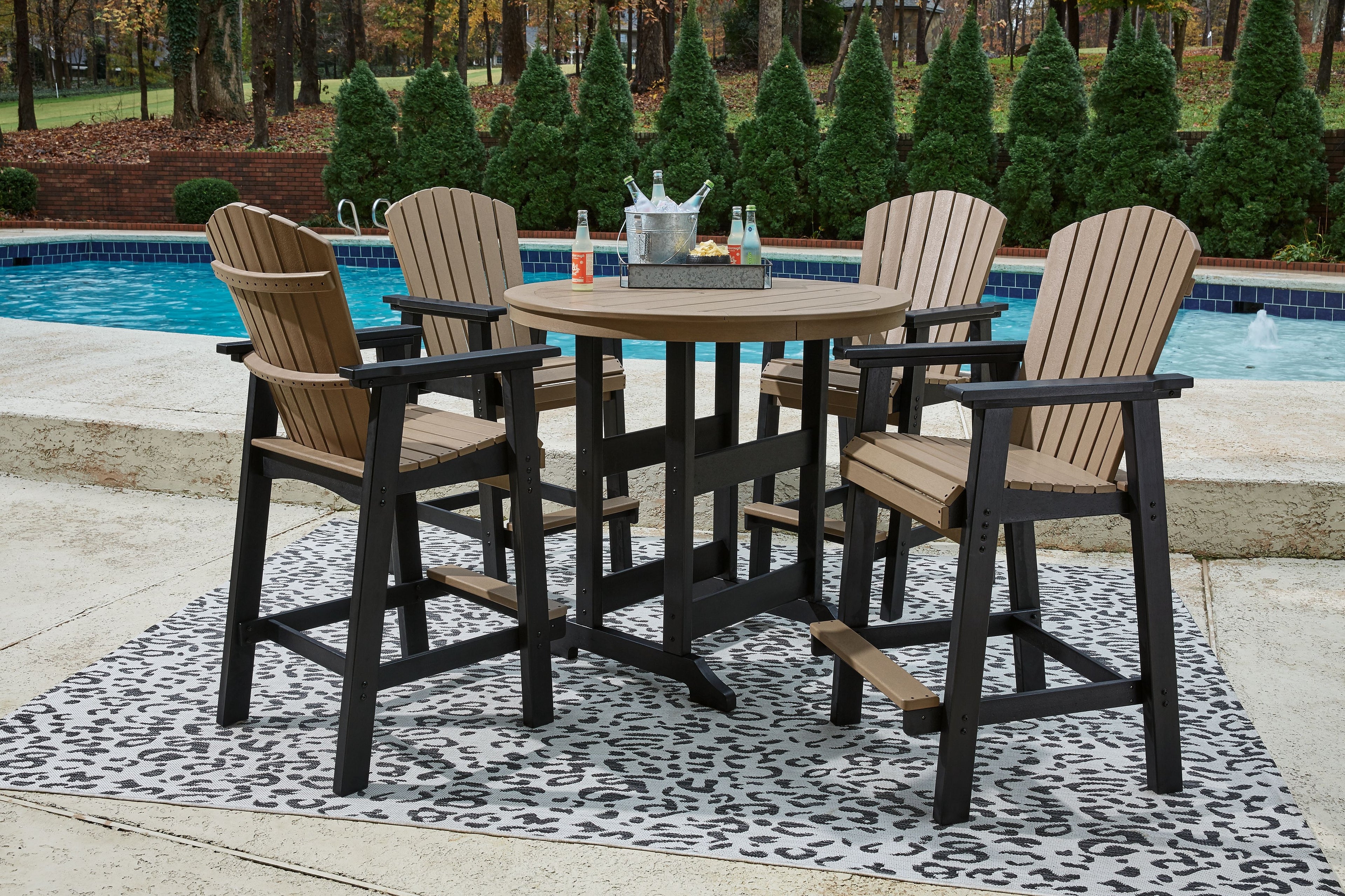 Outdoor dining set: round table and four chairs, black frames with driftwood slats