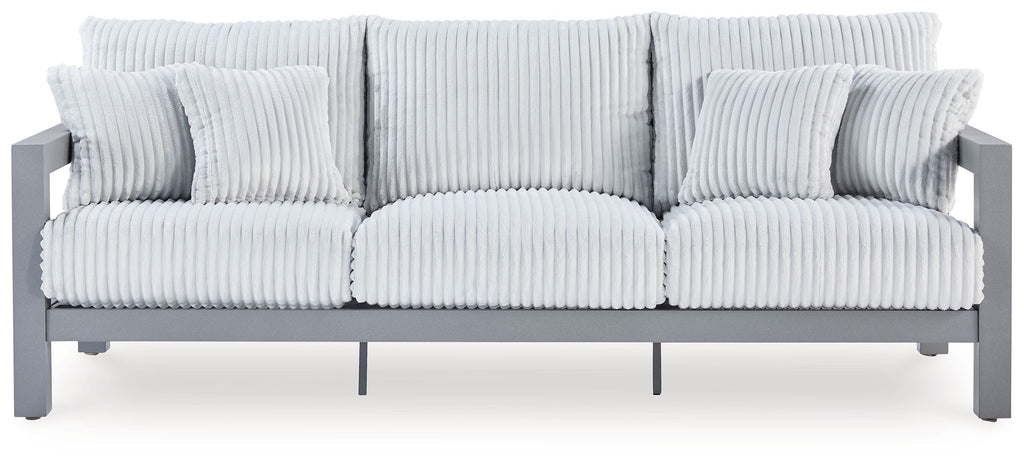 Hurley Park light gray outdoor sofa with ribbed cushions and back pillows