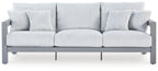 Hurley Park light gray outdoor sofa with ribbed cushions and back pillows