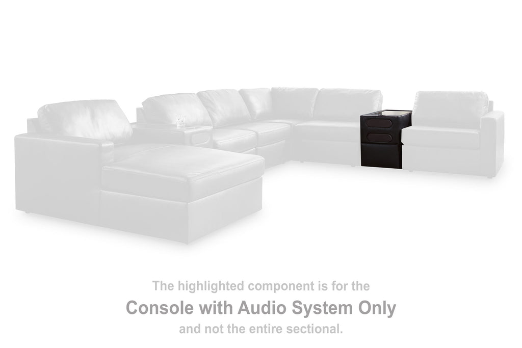 Black console with audio system, highlighted component