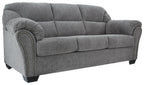 Pewter gray fabric sofa with tufted back, curved arms, and nailhead trim