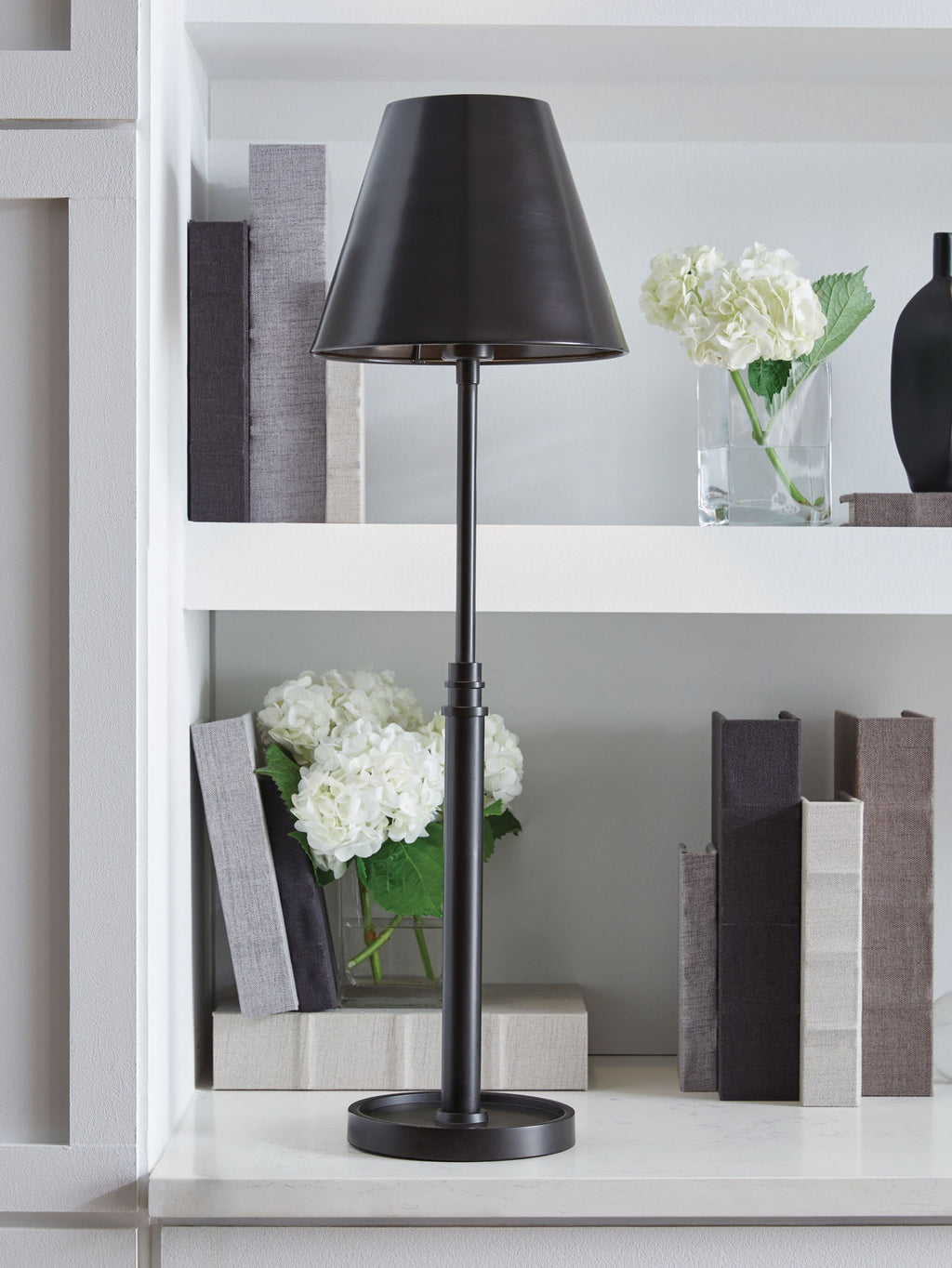 Black metal floor lamp with drum shade and circular base