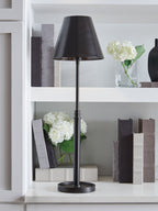 Black metal floor lamp with drum shade and circular base