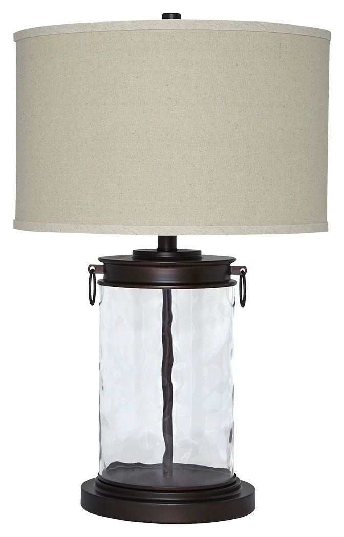 Clear glass table lamp with beige fabric drum shade and bronze base