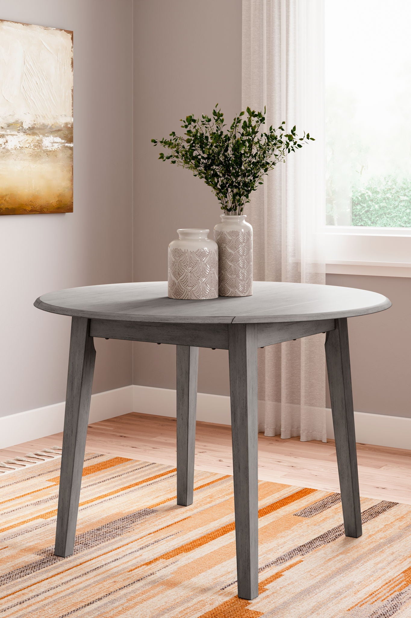 Gray drop-leaf dining table with four tapered legs