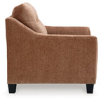 Brown upholstered sofa with chaise end and black feet