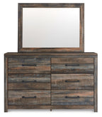 Wood dresser with large framed mirror above, four drawer fronts and black pulls