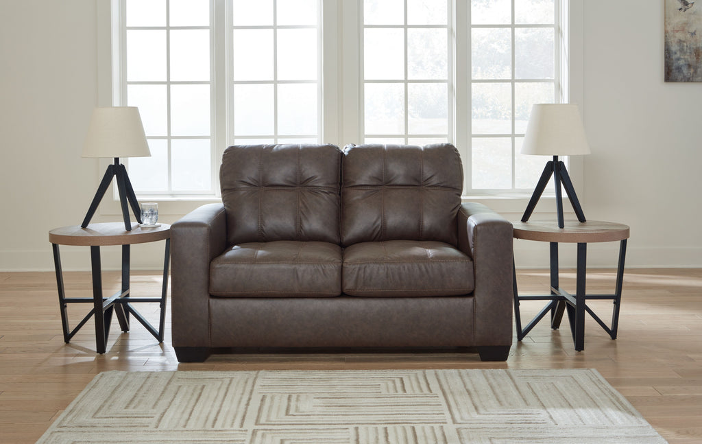 Black loveseat front view with tufted back and padded seat with divided cushions