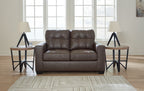 Black loveseat front view with tufted back and padded seat with divided cushions