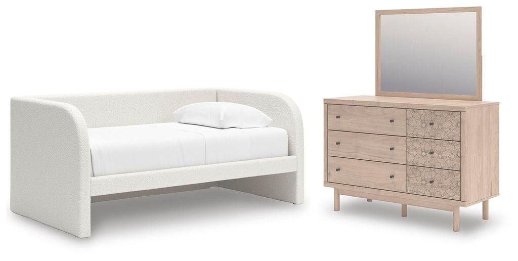 White upholstered day bed set with matching dresser and mirror