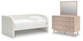 White upholstered day bed set with matching dresser and mirror