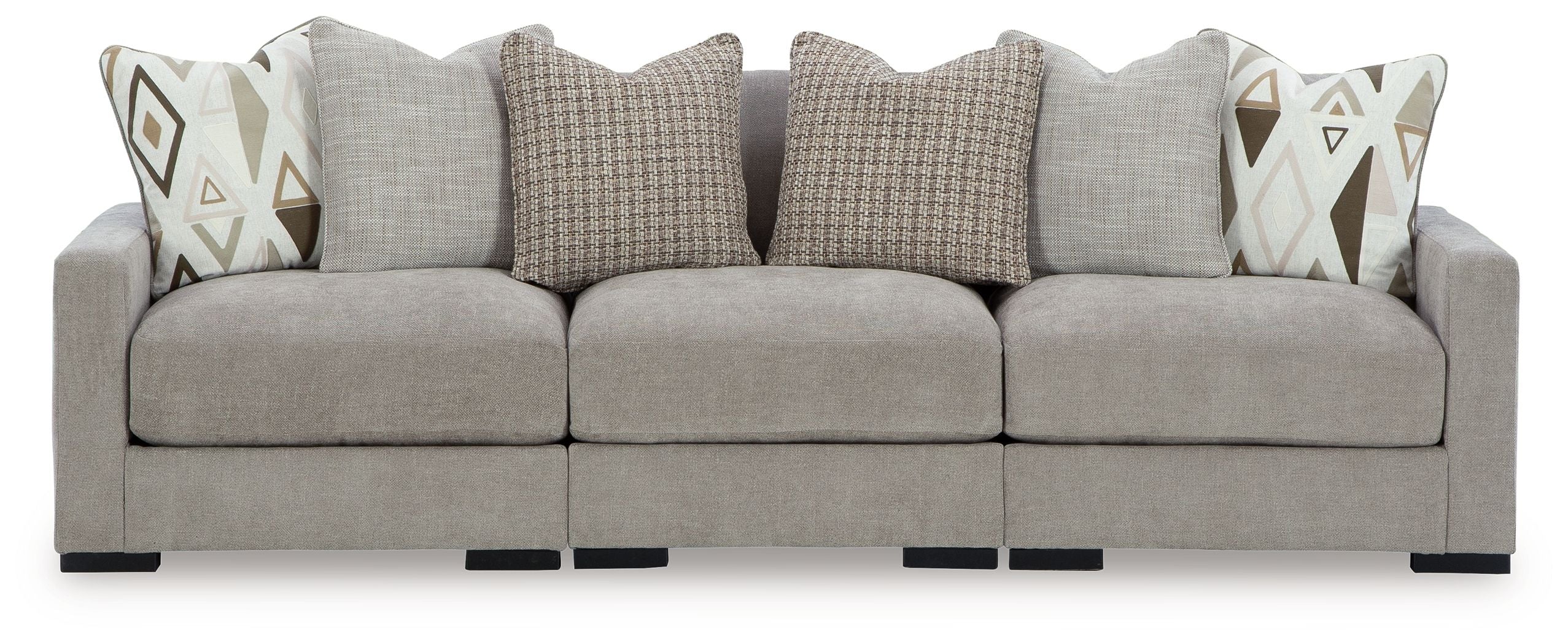 Pebble gray sectional sofa with three seat sections and geometric accent pillows