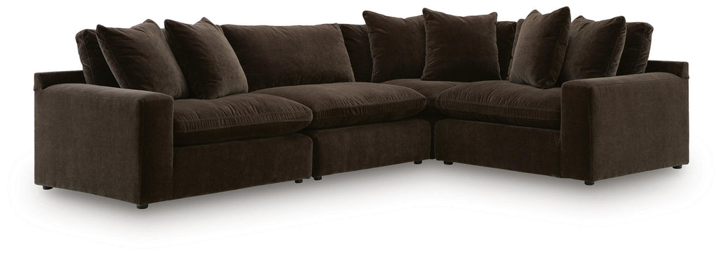Dark brown sectional sofa with deep seats, square arms, and back cushions on both sides.