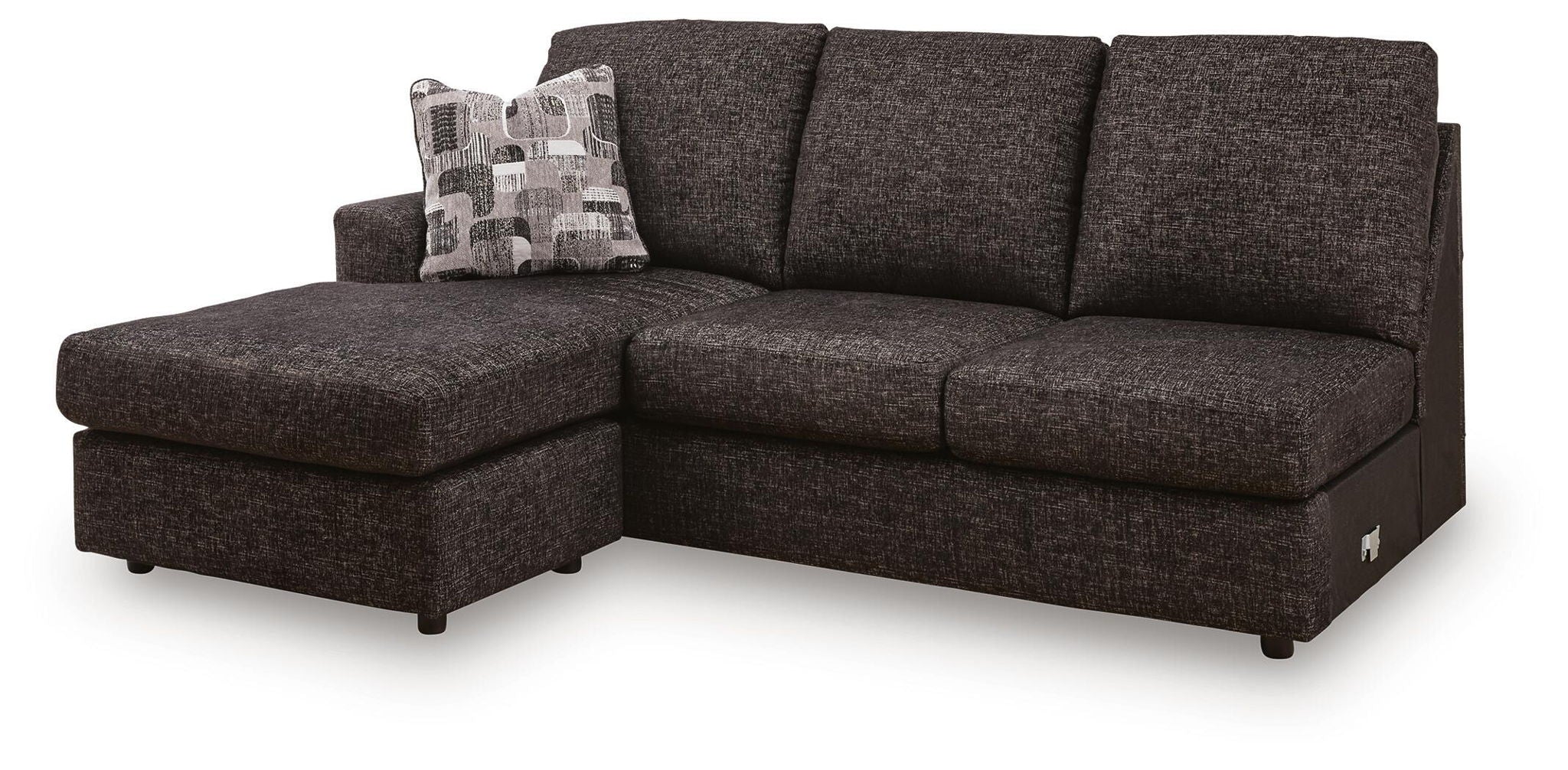 Dark gray fabric sofa chaise with chaise extension, tufted seat, and throw pillow