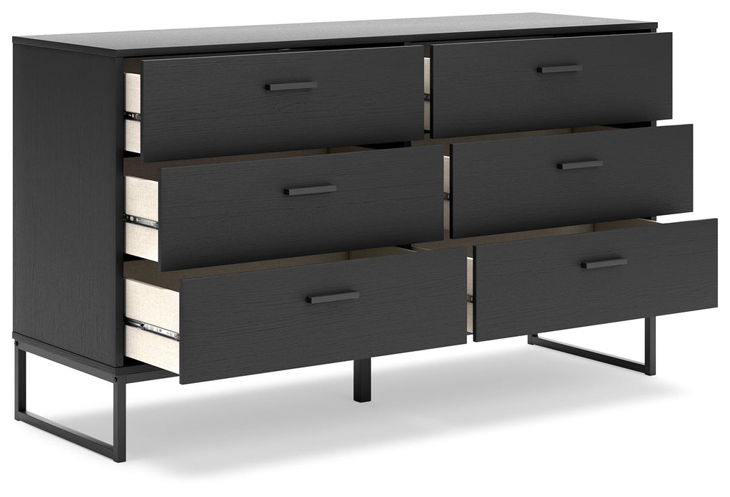 Black bedroom dresser with multiple drawers and metal drawer pulls