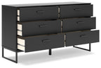 Black bedroom dresser with multiple drawers and metal drawer pulls