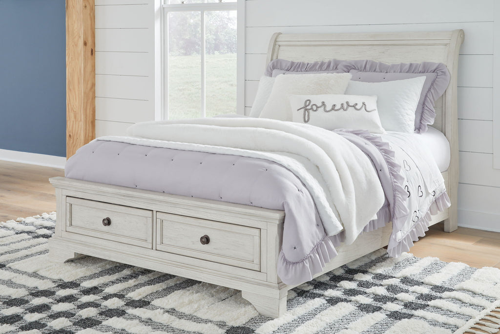 White sleigh bed with two storage drawers and paneled headboard